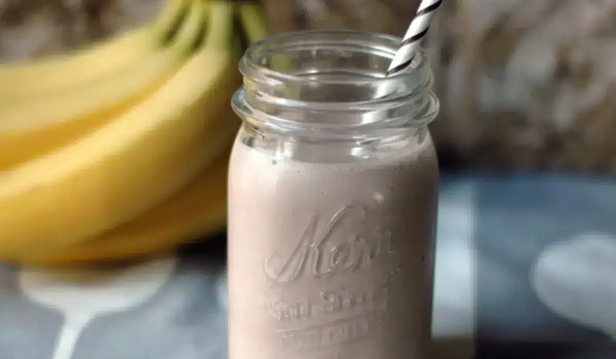 The image shows a close-up of a mason jar filled with a creamy, Herbalife Shake Recipe.