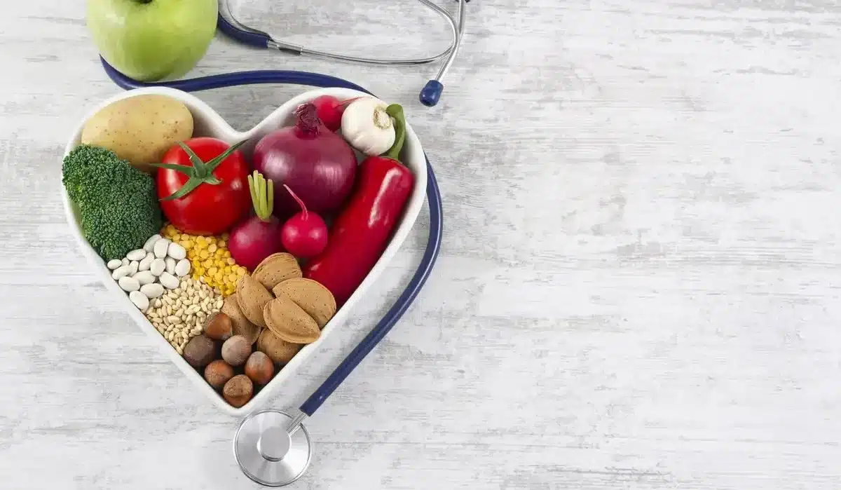 The image depicts a variety of healthy foods arranged in a heart-shaped bowl, from the medical medium diet.