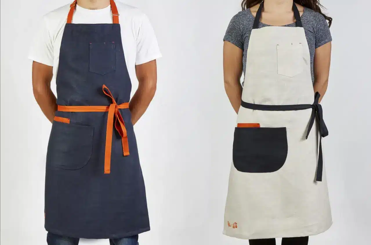 The image features two individuals, a man and a woman, wearing stylish Publix aprons.