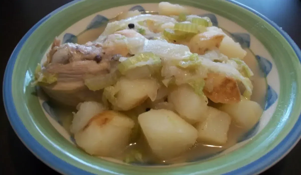 a green plate of likely a chicken souse
