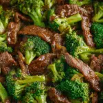 Beef and broccoli recipe close-up in wok