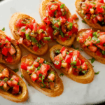 Bruschetta recipe with fresh tomatoes and basil on crispy ciabatta