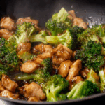 Close-up chicken and broccoli recipe stir-fry in brown sauce
