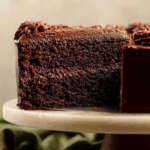 Moist chocolate zucchini cake slice with buttercream frosting