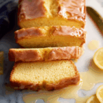 lemon yogurt cake glazed with lemon zest on rustic table